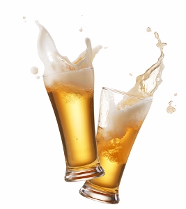 Two tall glasses of beer with frothy foam overflowing, captured mid-splash against a white background.